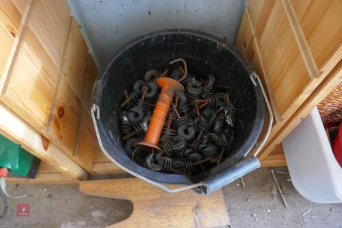 BUCKET OF FENCE INSULATORS