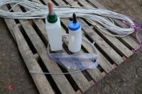 2 PLASTIC MILK FEEDERS & BAG