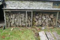 STACK OF UNPROCESSED FIREWOOD LOGS