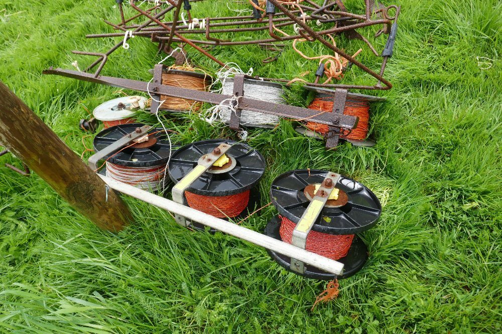 2 ELECTRIC FENCE REEL TREE POSTS