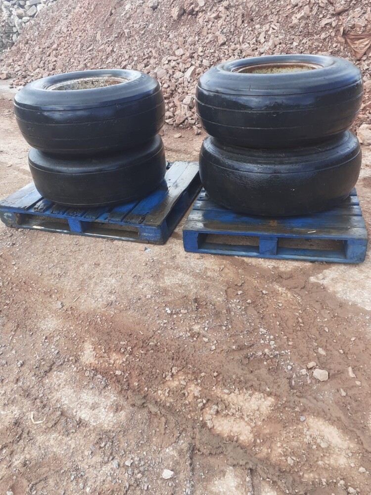 4 FORMER AEROPLANE TYRES AND RIMS