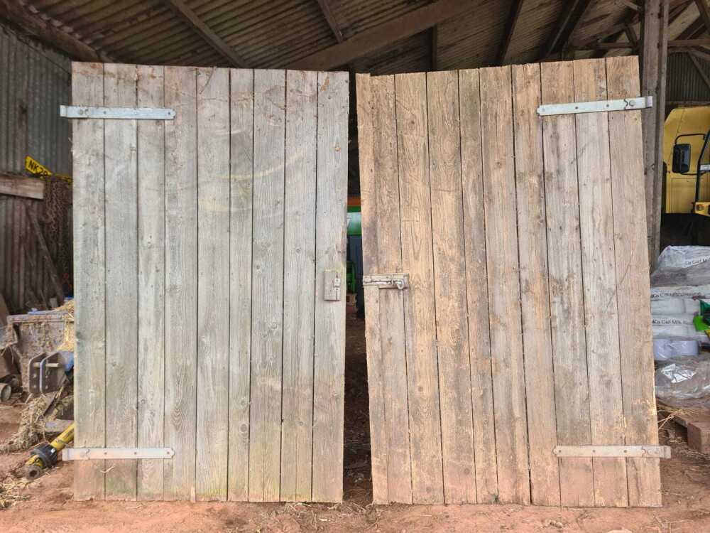 2 WOODEN GARAGE DOORS